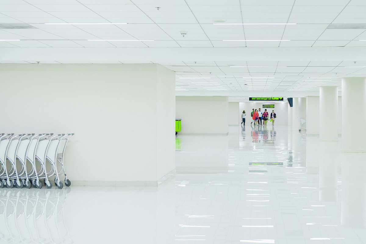 don mueang international airport people on hallway corridor